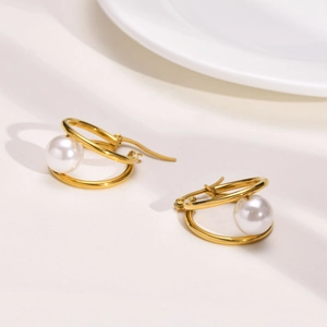 Elegant gold titanium steel hoop earrings with pearls in a double circle nesting design