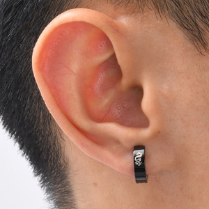 Men's black stainless steel ear clip earring with white dragon pattern on the ear