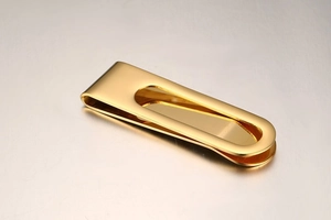 Polished gold stainless steel money clip with oval cutout and sleek mirror finish