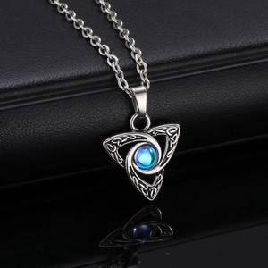 Detailed macro view of Celtic Triquetra pendant with moonstone and stainless steel chain