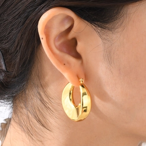 Minimalist chunky golden C-shaped hoop earrings with polished mirror finish for women