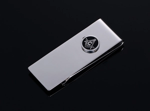 Polished stainless steel money clip featuring a detailed Freemasonry logo on a black surface