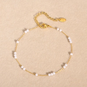 Golden stainless steel anklet with faux pearls featuring an adjustable K18 lobster clasp