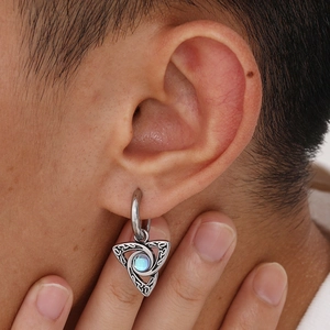 Close-up of Celtic knot moon earrings with light blue moonstone in vintage silver finish