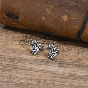 Vintage stainless steel Mjolnir hammer stud earrings with intricate Nordic engraving