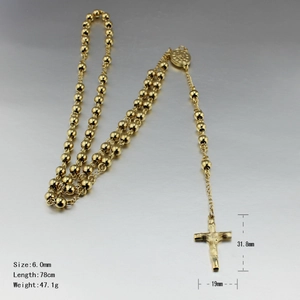 Detail of gold titanium steel rosary necklace showing beads and crucifix pendant dimensions