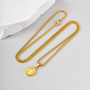 Detail of gold-plated oval cross pendant with textured edges and sturdy box chain