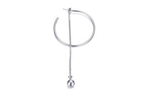 Detailed view of silver long chain tassel earring with geometric circle and sphere charm