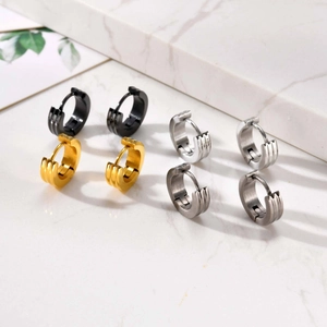 Three-groove stainless steel hoop earrings in black, gold, and silver finishes