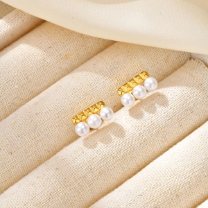 Elegant gold French-style pearl bar earrings with stylish pyramid stud accents