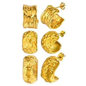 Three pairs of 18K gold plated C-shaped earrings with embossed texture on white background