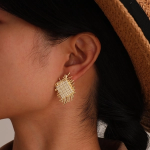 Elegant gold woven rectangle stud earrings with zircon stones on model ear