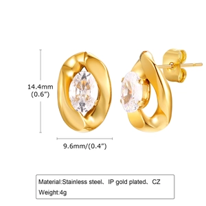 Detail of twisted gold earrings with cubic zirconia inlay and stainless steel plating