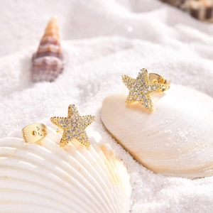S925 sterling silver star stud earrings with gold plating and white zircon on sand