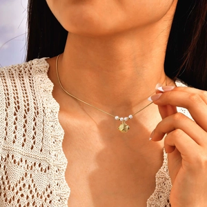 Gold tropical shell pendant necklace with white pearls on a minimalist link chain