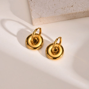 Polished gold stainless steel geometric hoop earrings with chunky donut charm