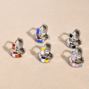 Set of five stainless steel hoop earrings with colorful geometric enamel tile designs