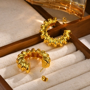 Fashionable gold C-shaped textured earrings with a vintage high-gloss metallic finish
