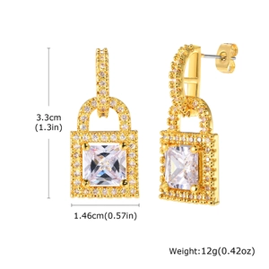 Detail view of gold padlock earrings with dimensions 3.3cm height and 1.46cm width
