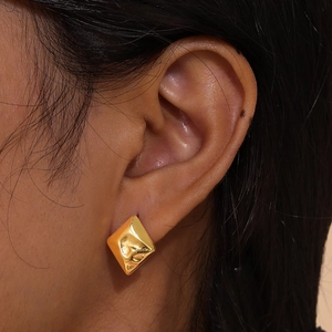 Gold stainless steel irregular geometric stud earrings with a hammered textured finish