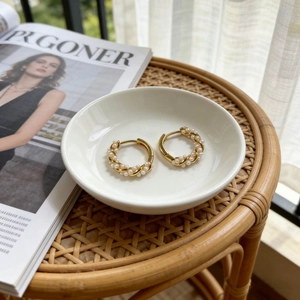 Elegant Mobius pearl hoop earrings featuring tiny pearls on golden spiral metal wire
