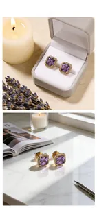 Macro detail of square purple crystal stud earrings with gold plating and white zircons