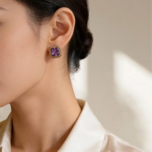 Elegant purple square gemstone studs with gold frame and crystal halo on model