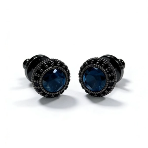 Detail view of vintage round stud earrings featuring dark blue zircon and black gold plating