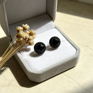 Vintage dark blue zircon studs with multifaceted center stone in a velvet gift box