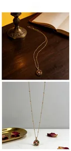 Detail of golden beaded necklace with colorful gemstone daisy flower pendant in vintage style