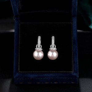 Elegant pink pearl drop earrings with crystal pavé silver hoops in a luxury velvet gift box