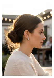 Detail showing elegant silver hoop earrings with pavé pearls on a female model