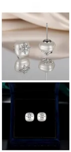Detail of star-shaped pearl earrings with zircon inlay in a velvet jewelry box display