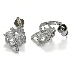 Close-up of square crystal earrings with silver multi-layer pavé setting and secure backings