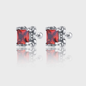 Close-up of square red ruby studs with retro crown silver setting and screw backs