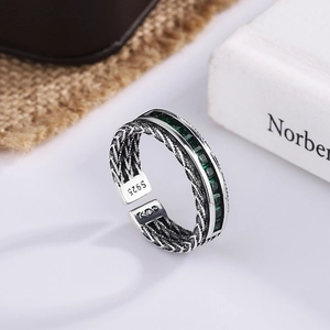 S925 sterling silver twisted ring with emerald green cubic zirconia in main angle