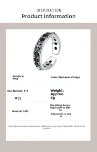 Macro detail of S925 sterling silver gothic ring with black zircon cross relief pattern