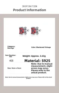 Macro detail of S925 silver stud earrings with square red zircon and retro finish
