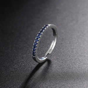 Detail macro shot of adjustable 925 silver ring with dark blue channel-set cubic zirconia