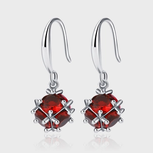 Elegant 925 sterling silver drop earrings with faceted red zircon in spherical cages