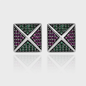 Macro detail of 925 silver pyramid earrings with green and purple zircon pavé inlay