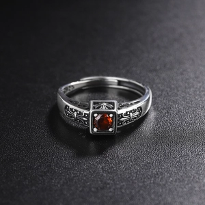 Vintage 925 sterling silver open ring with cross patterns and a red zircon centerpiece