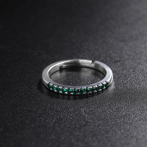 Adjustable 925 sterling silver ring with vibrant green cubic zirconia row setting