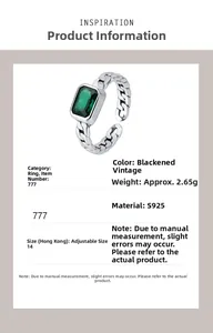 Detail view of adjustable 925 silver ring with emerald square zircon and chain texture band