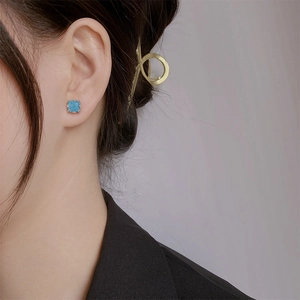 Vintage S925 square blue zircon stud earrings with gold plating shown on model