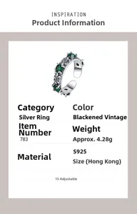Detailed view of S925 silver ring with emerald gems and vintage gothic engraving