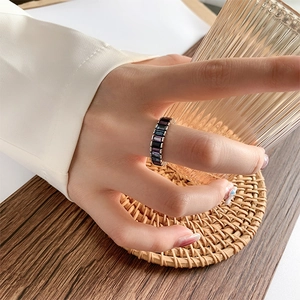 Adjustable open ring with gradient baguette-cut gems on a silver metal band