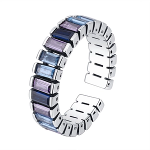 Adjustable silver ring with rectangular gradient blue and purple crystals on white backdrop