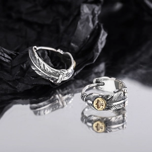 Vintage S925 sterling silver feather hoop earrings with gold bird accent in ethnic style