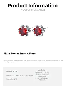 Detail view of 925 sterling silver studs with 5mm red zircon in a six-prong setting